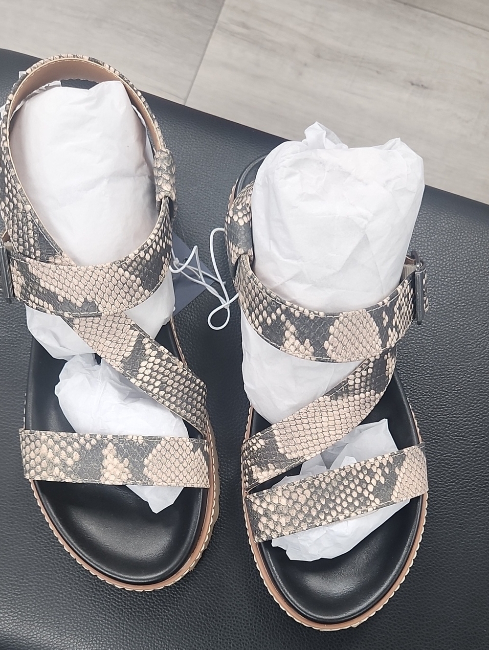 Universal Snake-Print Crisscross Sandals in Black and Beige